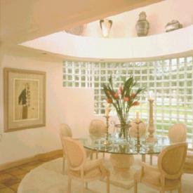 Create the feeling of outdoor dining with a curved wall of glass block.  